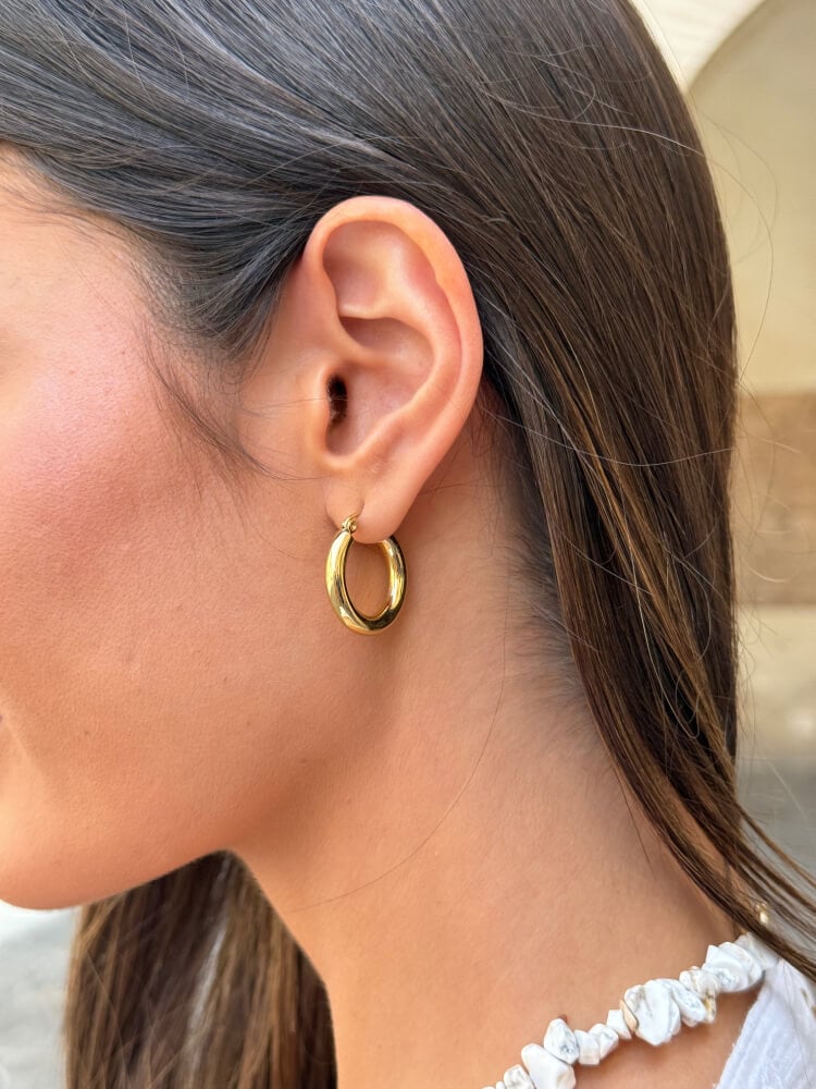 Aros en acero dorado con acabado brillante