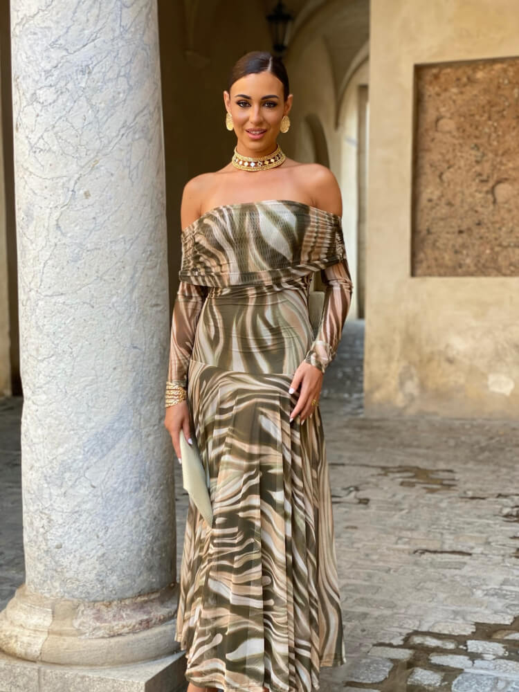 Vestido en un tono verde con un estampado delicado y manga larga